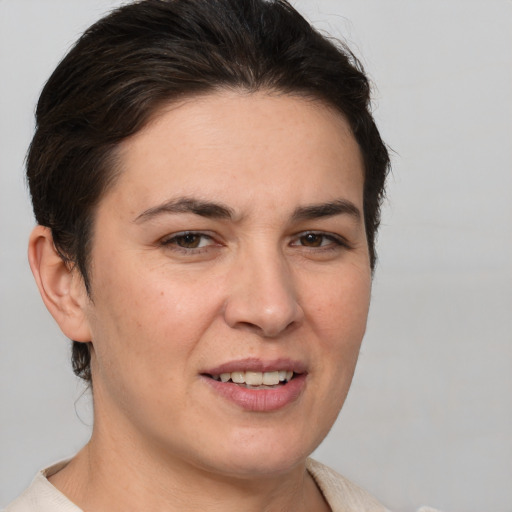 Joyful white young-adult female with medium  brown hair and brown eyes