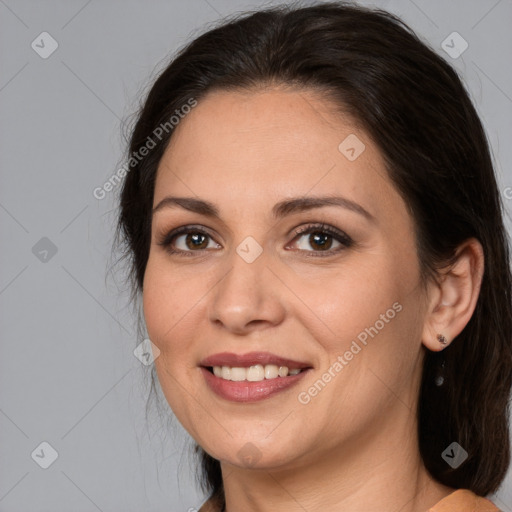 Joyful white adult female with medium  brown hair and brown eyes