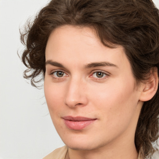 Joyful white young-adult female with medium  brown hair and green eyes