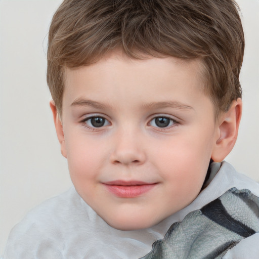 Joyful white child male with short  brown hair and grey eyes