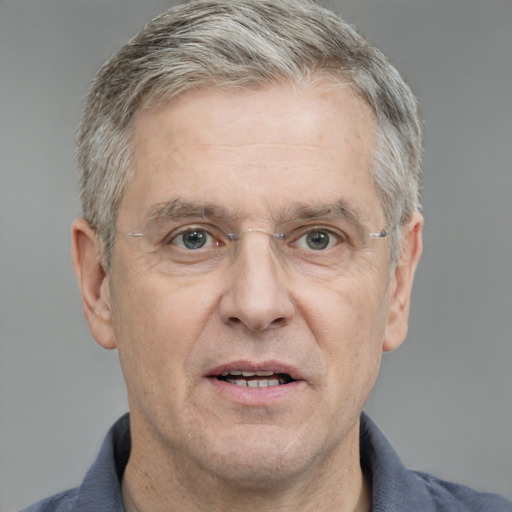 Joyful white middle-aged male with short  gray hair and grey eyes