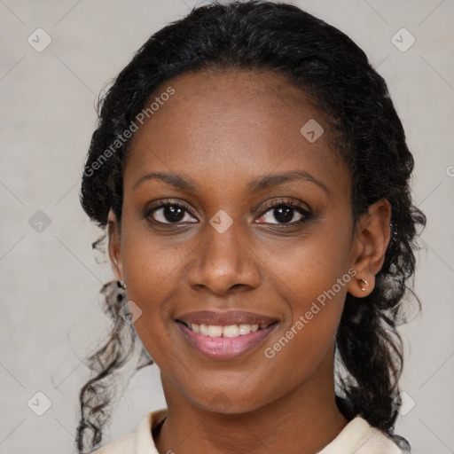 Joyful black young-adult female with medium  brown hair and brown eyes