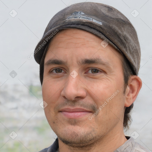 Joyful white adult male with short  black hair and brown eyes