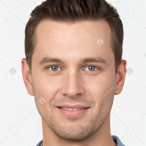 Joyful white young-adult male with short  brown hair and grey eyes