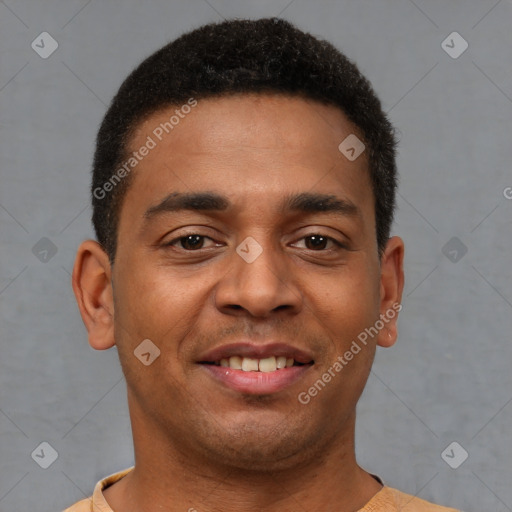 Joyful latino young-adult male with short  brown hair and brown eyes