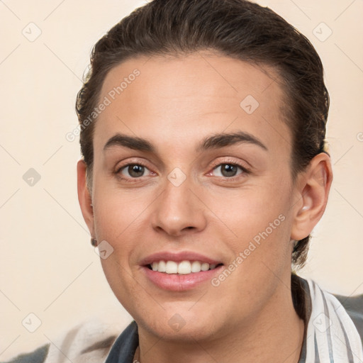 Joyful white young-adult female with short  brown hair and brown eyes