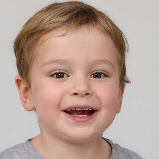 Joyful white child female with short  brown hair and blue eyes