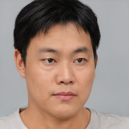 Neutral asian young-adult male with short  brown hair and brown eyes