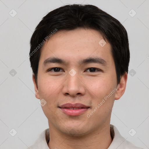 Joyful asian young-adult male with short  black hair and brown eyes