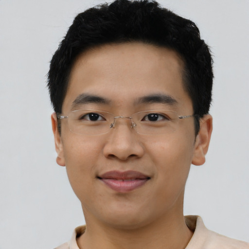 Joyful latino young-adult male with short  brown hair and brown eyes