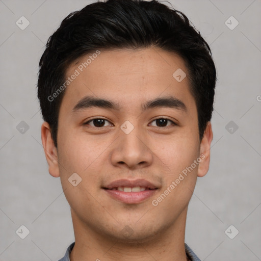 Joyful asian young-adult male with short  brown hair and brown eyes