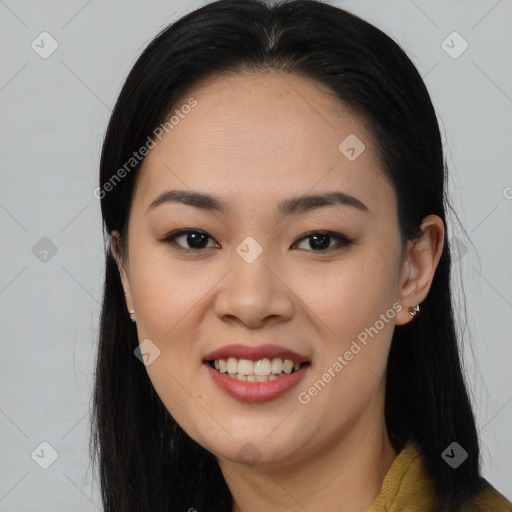 Joyful asian young-adult female with long  brown hair and brown eyes