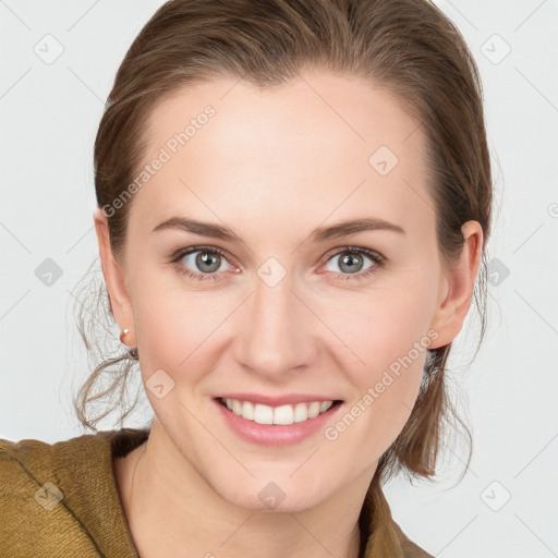 Joyful white young-adult female with long  brown hair and blue eyes