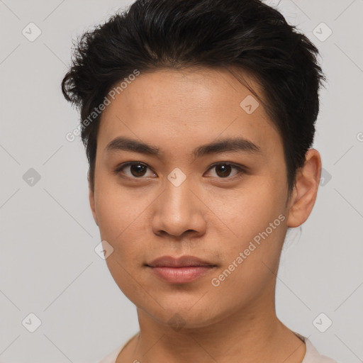 Joyful asian young-adult male with short  brown hair and brown eyes