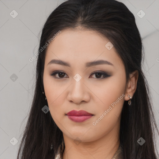 Joyful asian young-adult female with long  brown hair and brown eyes