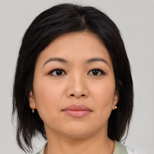 Neutral asian young-adult female with medium  brown hair and brown eyes