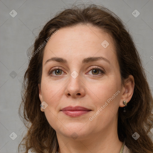 Joyful white young-adult female with long  brown hair and green eyes