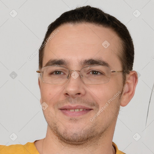 Joyful white adult male with short  brown hair and brown eyes