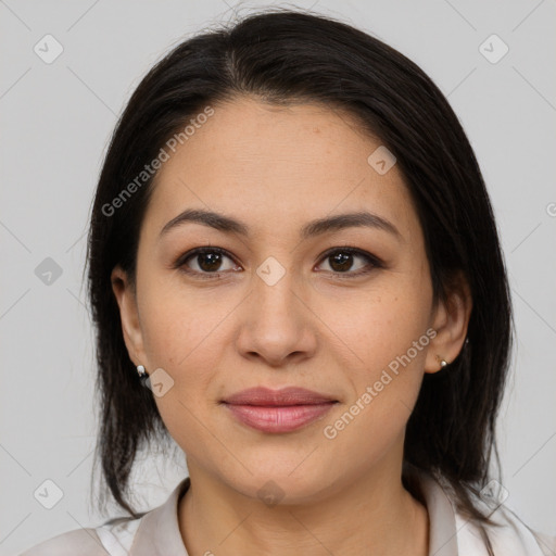 Joyful latino young-adult female with medium  brown hair and brown eyes