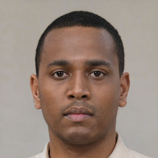 Neutral black young-adult male with short  black hair and brown eyes