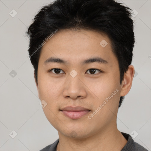 Joyful asian young-adult male with short  black hair and brown eyes