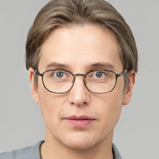 Joyful white adult male with short  brown hair and grey eyes