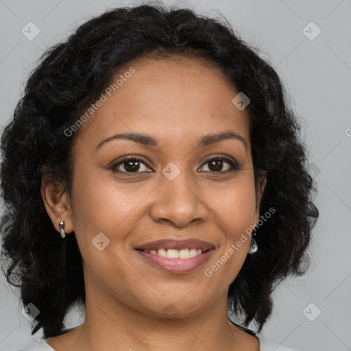 Joyful black adult female with medium  brown hair and brown eyes