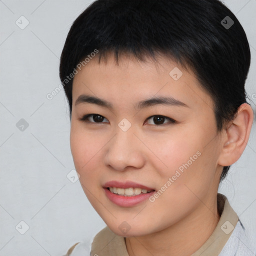 Joyful asian young-adult female with short  brown hair and brown eyes