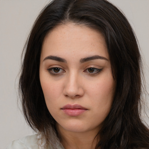 Neutral white young-adult female with long  brown hair and brown eyes