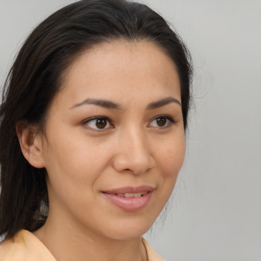 Joyful asian young-adult female with medium  brown hair and brown eyes
