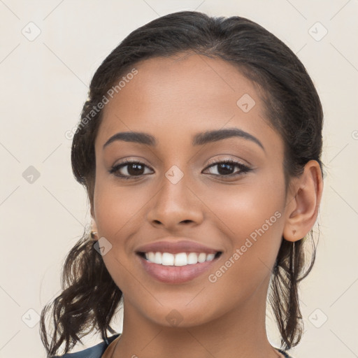 Joyful latino young-adult female with long  brown hair and brown eyes