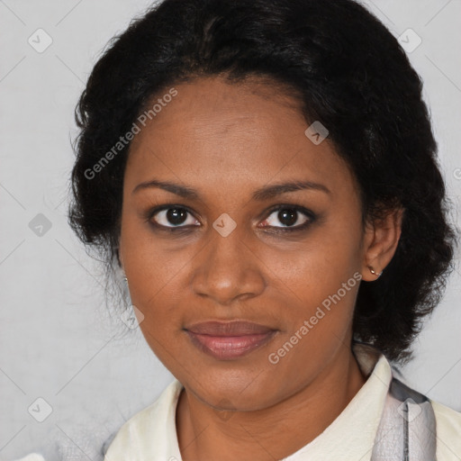 Joyful black adult female with short  brown hair and brown eyes