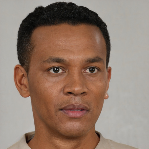 Neutral black young-adult male with short  brown hair and brown eyes