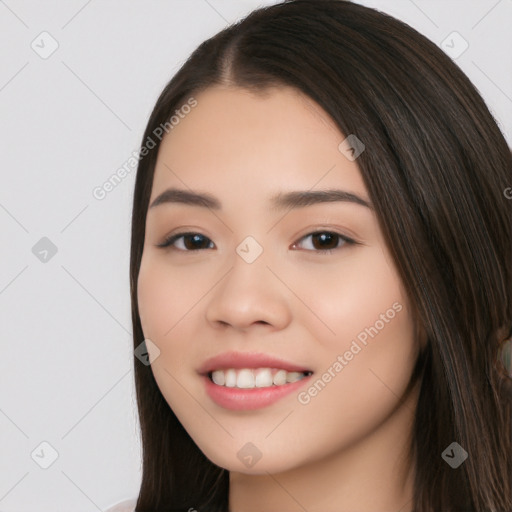 Joyful white young-adult female with long  black hair and brown eyes