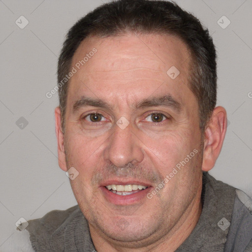 Joyful white adult male with short  brown hair and brown eyes