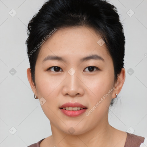 Joyful asian young-adult female with short  black hair and brown eyes