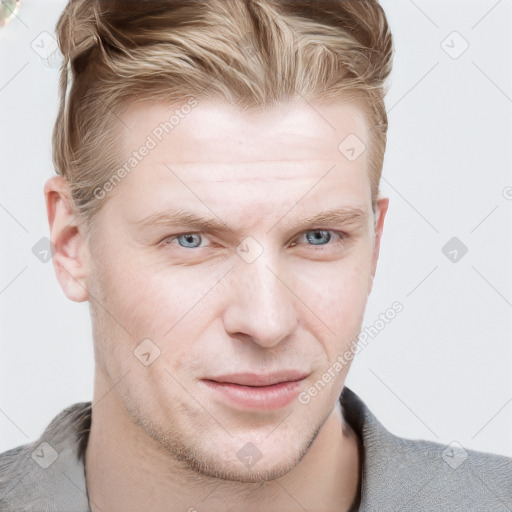 Joyful white young-adult male with short  brown hair and blue eyes