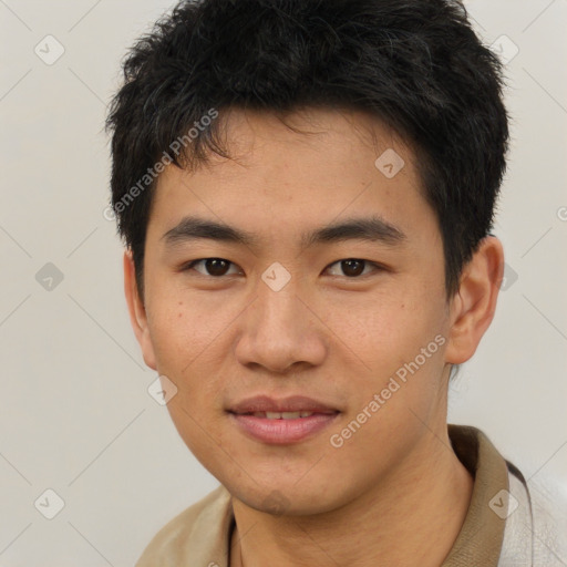 Joyful asian young-adult male with short  brown hair and brown eyes