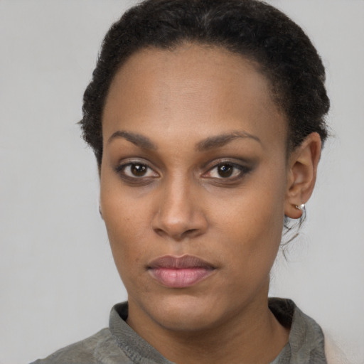 Neutral black young-adult female with short  brown hair and brown eyes