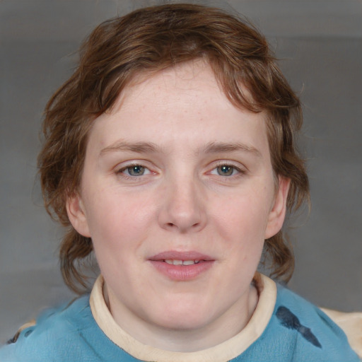 Joyful white young-adult female with medium  brown hair and blue eyes