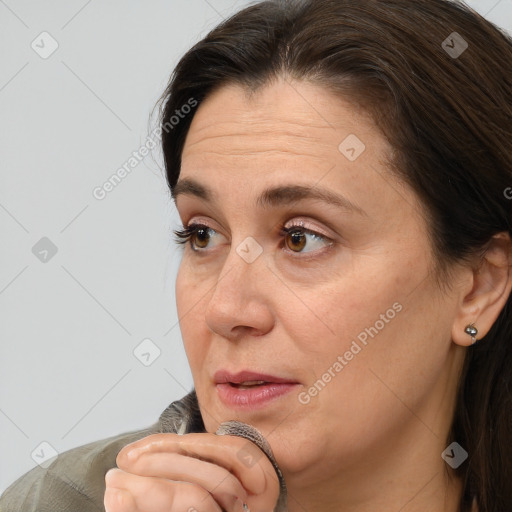 Joyful white adult female with short  brown hair and brown eyes