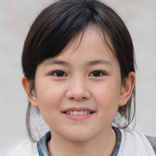 Joyful white child female with medium  brown hair and brown eyes