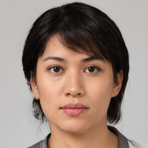 Neutral asian young-adult female with medium  brown hair and brown eyes