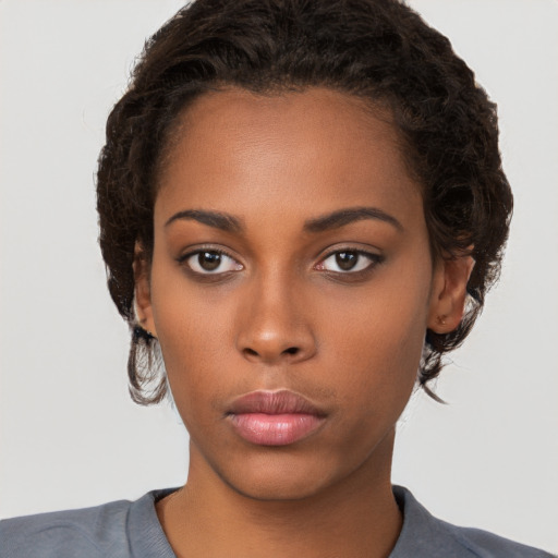 Neutral black young-adult female with short  brown hair and brown eyes