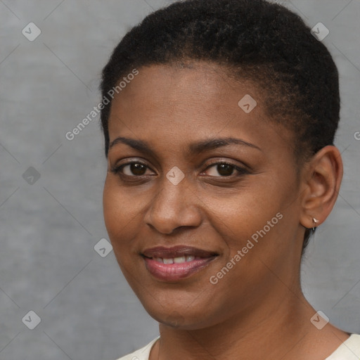 Joyful black young-adult female with short  brown hair and brown eyes