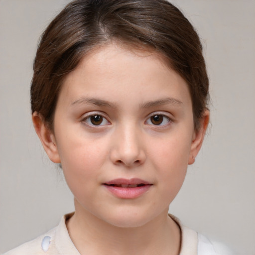 Joyful white child female with short  brown hair and brown eyes