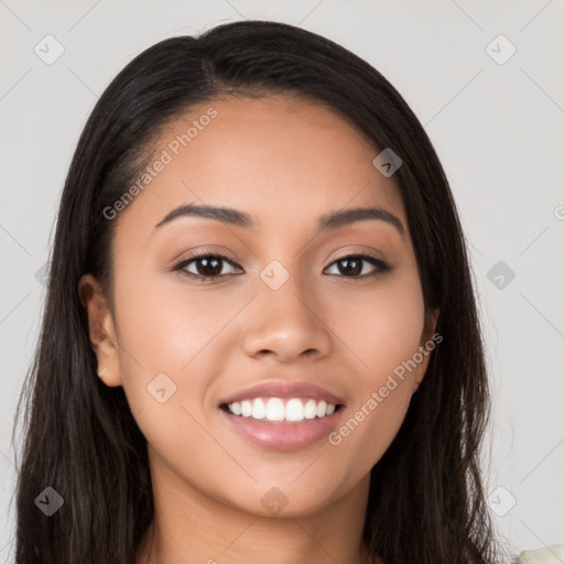 Joyful latino young-adult female with long  black hair and brown eyes