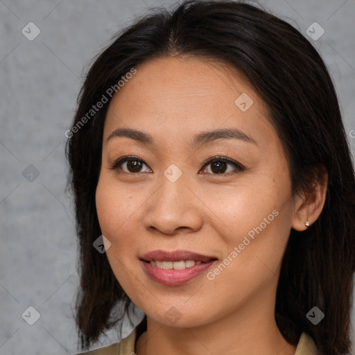 Joyful asian young-adult female with long  brown hair and brown eyes