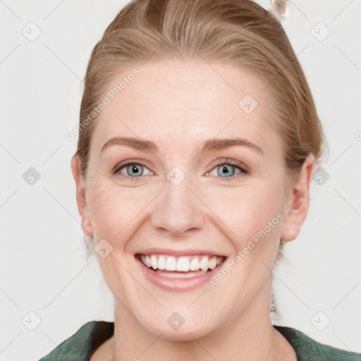 Joyful white young-adult female with medium  brown hair and blue eyes