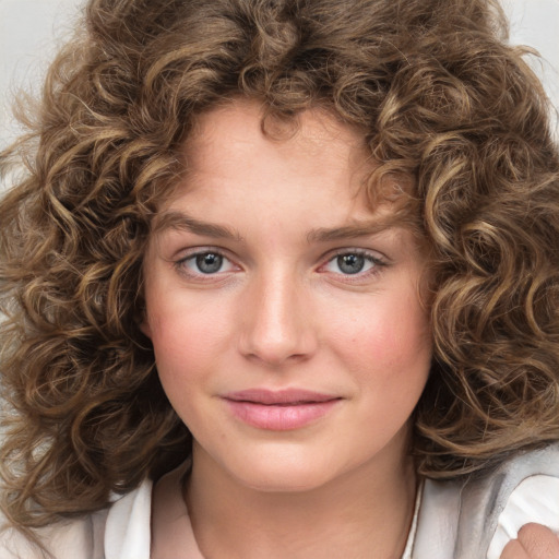 Joyful white young-adult female with medium  brown hair and green eyes